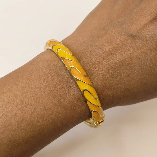 Amber Wave Bangle worn on wrist, waterproof nickel-free steel jewellery