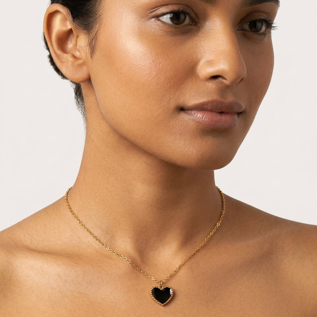 Black Enamel Heart Necklace close-up worn on neck