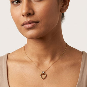 Roman Numeral Heart Pendant Necklace worn on neck