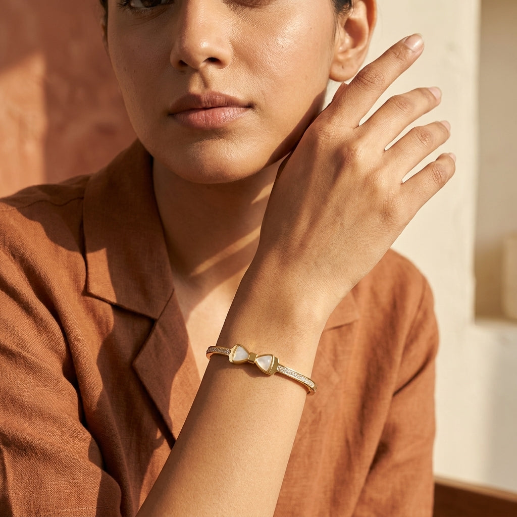 Pearl Bow Zircon Handcuff worn on wrist