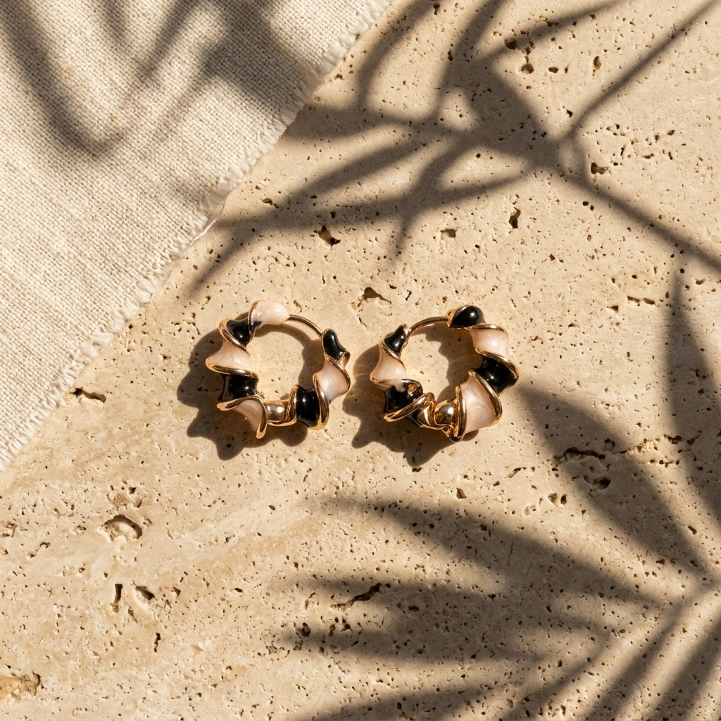 Twisted Petal Hoop Earrings — Noir Blush Twist colorway, waterproof steel
